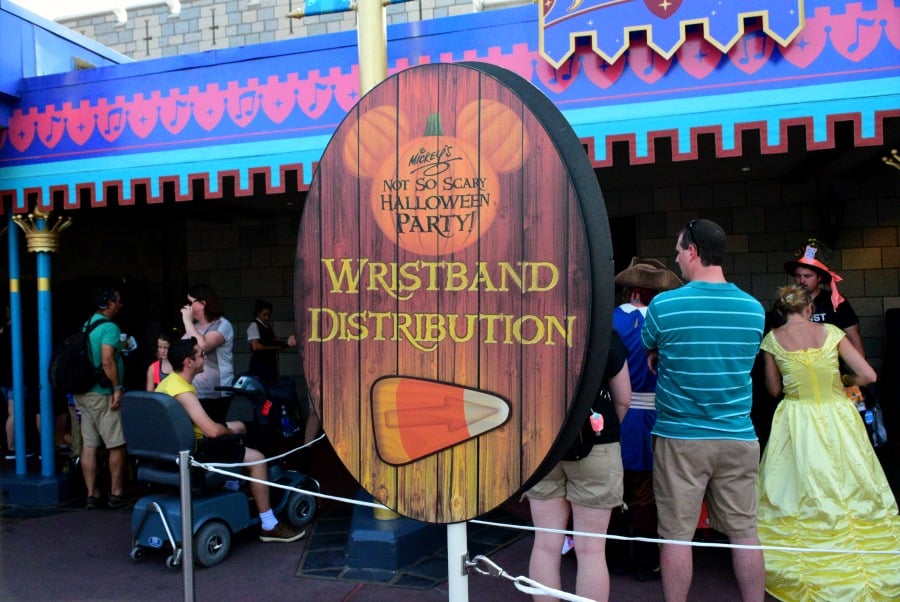 You can get MNSSHP wristbands at the park entrance or in a couple of locations inside Magic Kingdom.