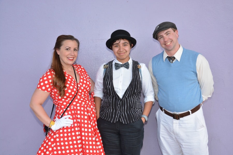 A family photo at The Purple Wall in Magic Kingdom!