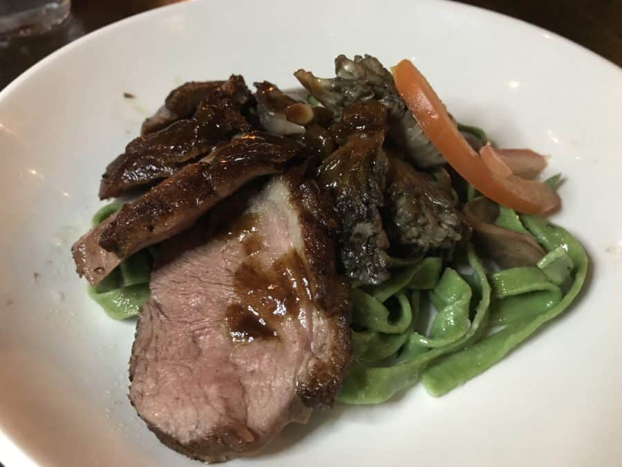 Smoked Duck Breast with Wild Mushrooms, Fresh Spinach Linguine, and White Truffle Oil at Il Pizzaiolo
