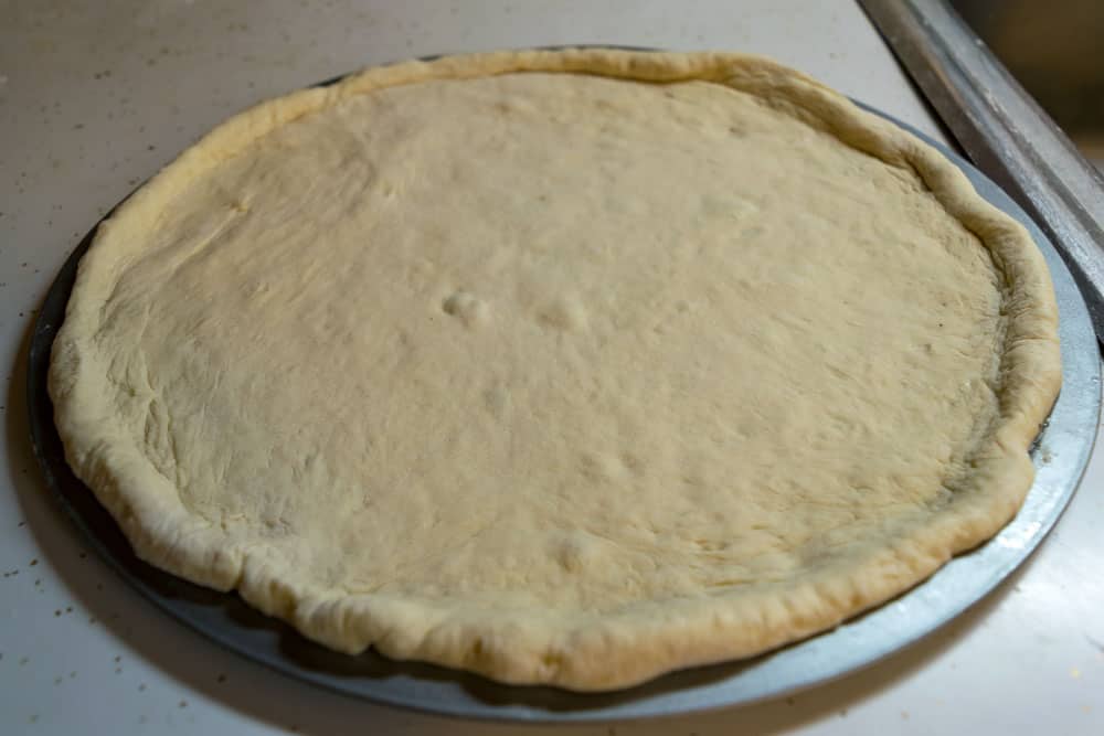 Feel free to use any style of pizza dough you want for this cheesy pierogi pizza recipe. 
