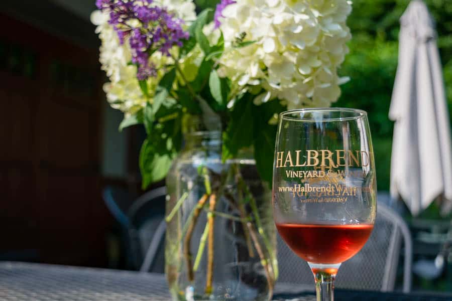 Outdoor patio seating and wine tasting at Halbrendt Winery. 