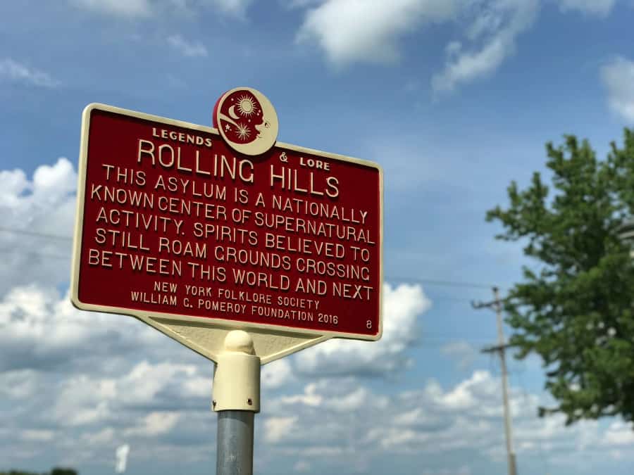 Haunted History Trail of New York State: An exterior sign at Rolling Hills Asylum letting you know what you're in for when you step inside.