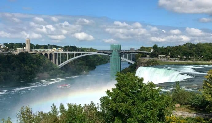 A view of Niagara Falls, Canada and the Rainbow Bridge from the walking paths near Maid of the Mist. Photo Credit: Karyn Locke
