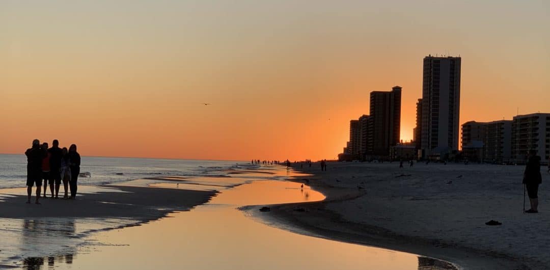 Family on Orange beach at sunsetjpg