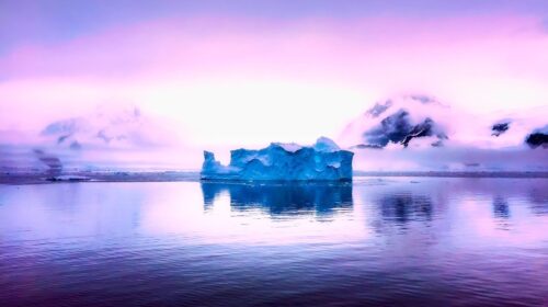 post pandemic travel planning antarctica beautiful sky and iceberg