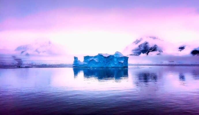 post pandemic travel planning antarctica beautiful sky and iceberg