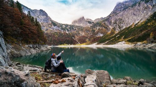 How To Prepare for Your First Hiking Trip - couple looking at mountain view