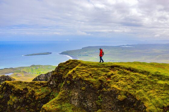 How To Prepare for Your First Hiking Trip - girl looking at meadow