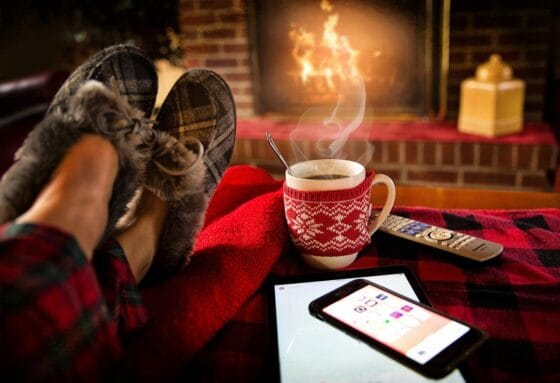 Ways To Keep Your Home Comfortable as It Gets Colder - fireplace and hot cocoa
