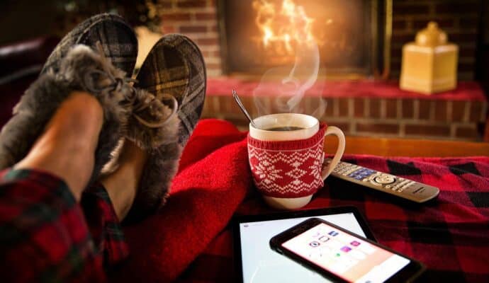Ways To Keep Your Home Comfortable as It Gets Colder - fireplace and hot cocoa