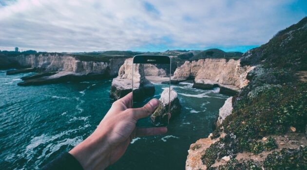 Tips to Plan a Memorable Vacation Without Stress how to prepare your phone for a long vaca - photo of phone and cliff