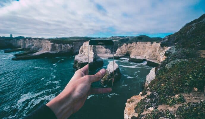 how to prepare your phone for a long vaca - photo of phone and cliff