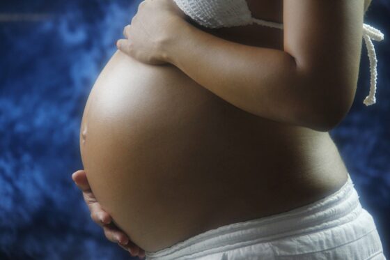 items in a midwife's bag - pregnant woman's belly