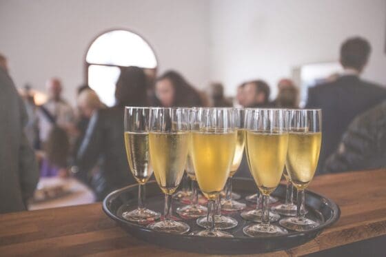 6 Practical Tips for Organizing a Great Event - champagne on a tray