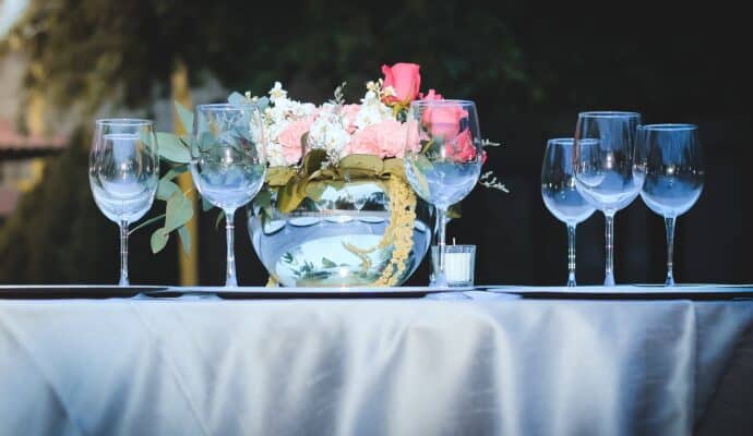 6 Practical Tips for Organizing a Great Event - empty wine glasses and flowers