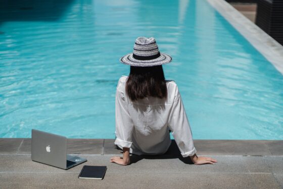 Best Business Ideas for Travelers - writing by an outdoor pool