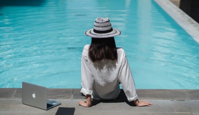 Best Business Ideas for Travelers - writing by an outdoor pool
