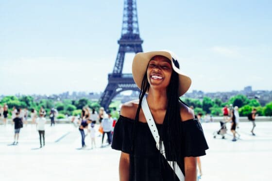 language holidays as a student - eiffel tower with girl smiling