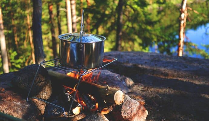 How To Stay Safe During a Camping Trip - campfire cooking