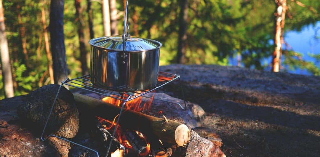 How To Stay Safe During a Camping Trip - campfire cooking