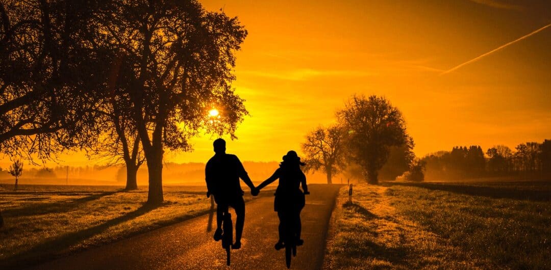 Must-Know Tips For A Fun Family Cycling Holiday 7 Why Are Couples’ Getaways Important for relationships - biking at sunset