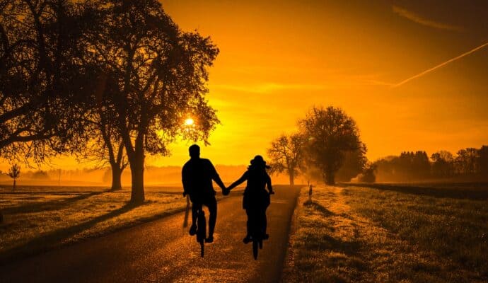 Why Are Couples’ Getaways Important for relationships 
- biking at sunset