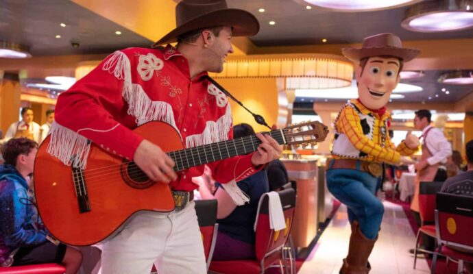 pixar day at sea 2024 - woody and guitar player