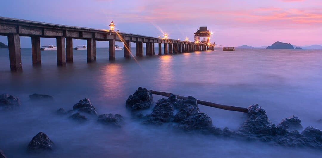 is costco travel worth it? Calm beach with pier
Why Waterfront Cities Make the Best Mini-Vacations