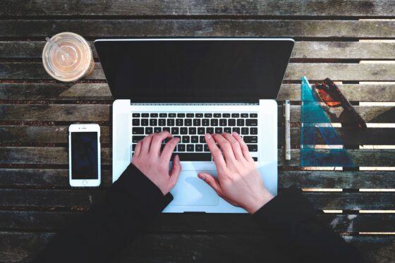 is costco travel worth it? woman at laptop researching travel