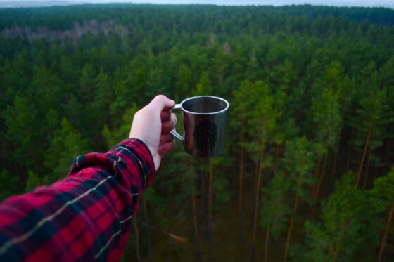 How To Have a Successful Camping Trip With a Generator - coffee cup and mountains