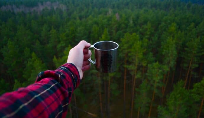 How To Have a Successful Camping Trip With a Generator - coffee cup and mountains