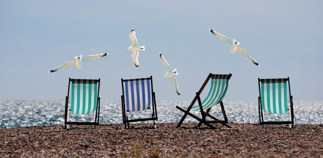 Plan a fun and fabulous beach holiday for the whole squad with these top tips on how to plan a group beach getaway - beach chairs