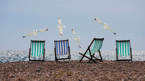 Plan a fun and fabulous beach holiday for the whole squad with these top tips on how to plan a group beach getaway - beach chairs