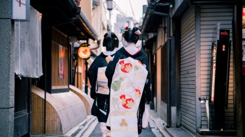 geigi culture - geisha walking down a street