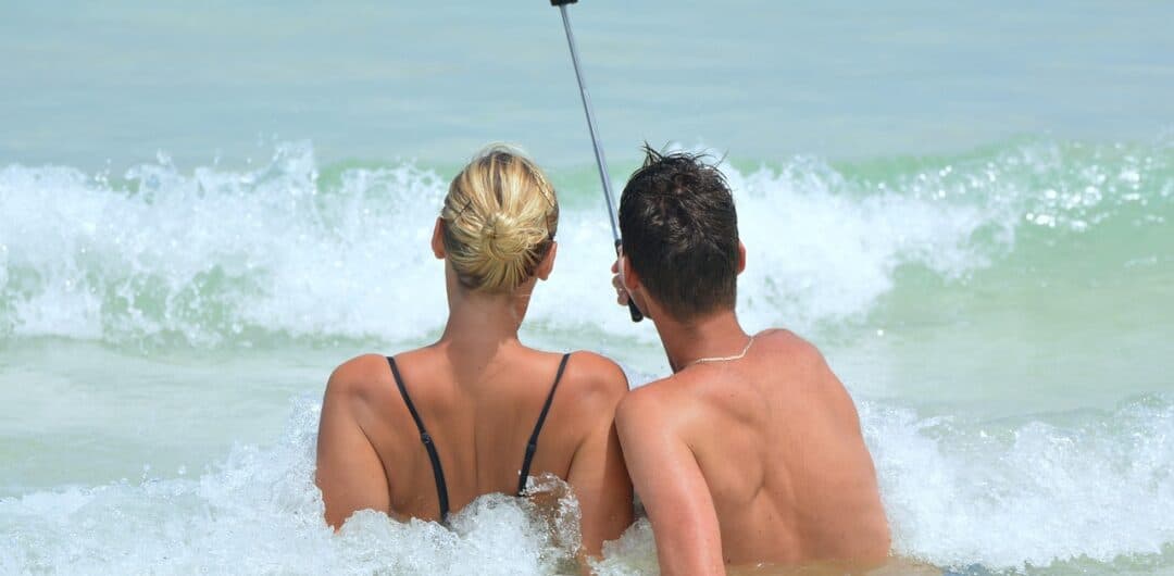 Biggest Travel Pet Peeves - selfies and selfie stick in ocean