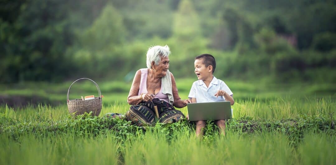 skip-gen travel - boy and grandmother in field