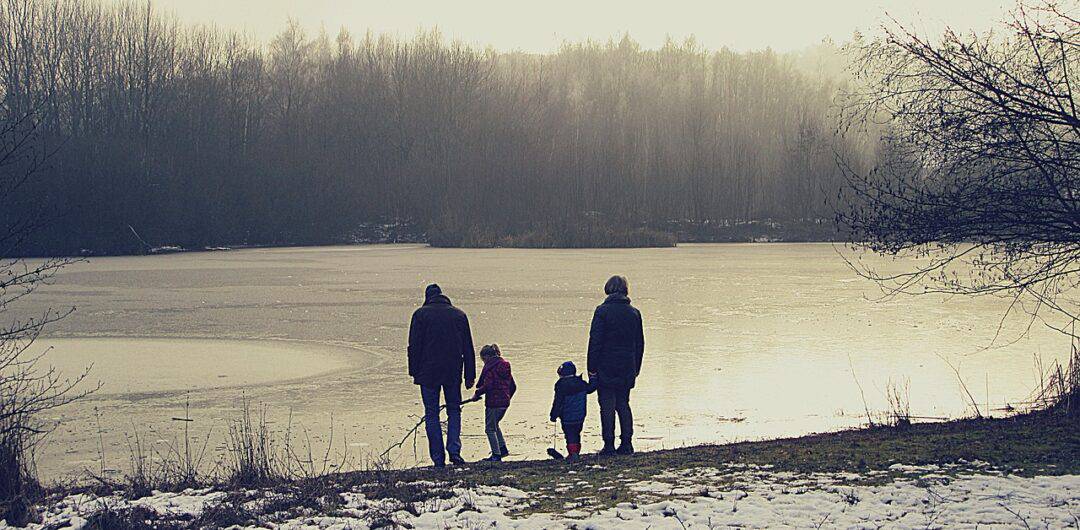 skip-gen travel - grandparents on wintery lake
