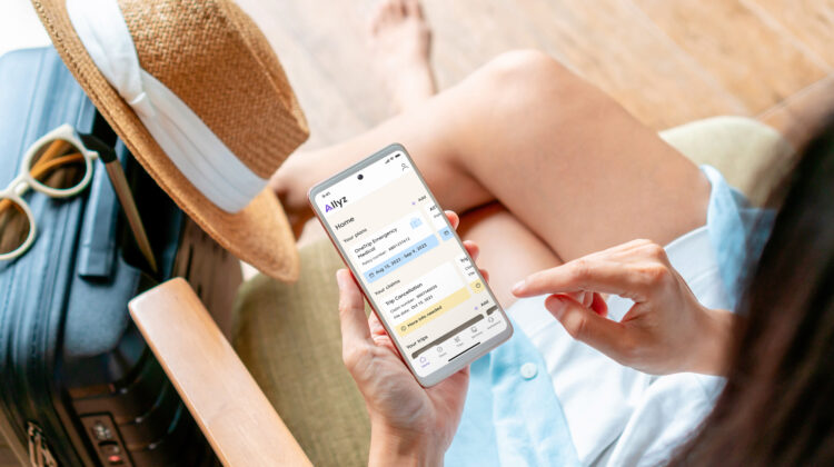 Allyz Allianz Travel Insurance - looking at phone