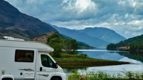 perfect RV adventure - How to Prepare for Your First RV Trip - camper van with mountains