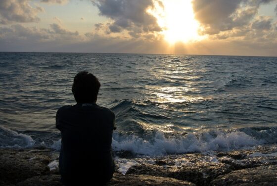 Tips To Stop Homesickness - man at ocean
