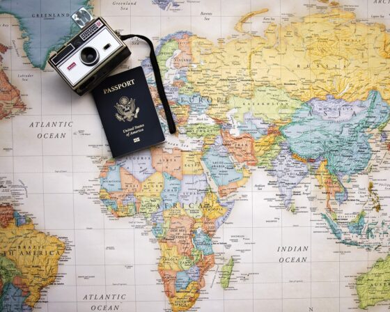 Travel Tips You Need To Avoid A Stressful Vacation - passport travel documents and camera
