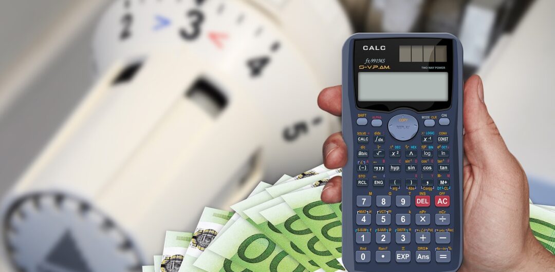 Unexpected Travel Expenses (And How to Avoid Them) - hand with calculator