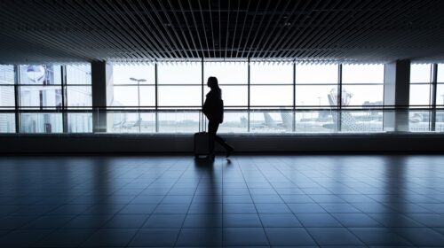 Tips to Make Your Vacation Less Stressful & More Enjoyable - person with luggage