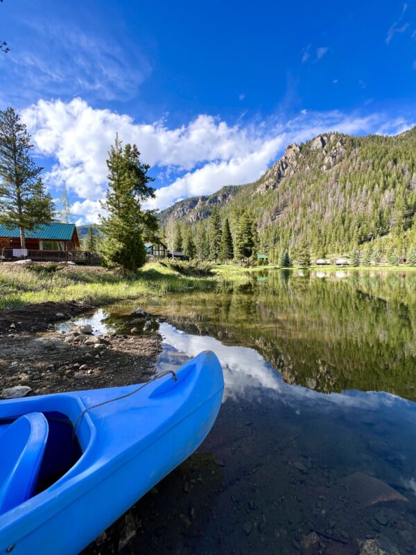 From Glamping to Grand Views: Your Ultimate Northern Colorado Retreat at Arapaho Valley Ranch 3 Arapaho Valley Ranch's onsite lake with kayaks.