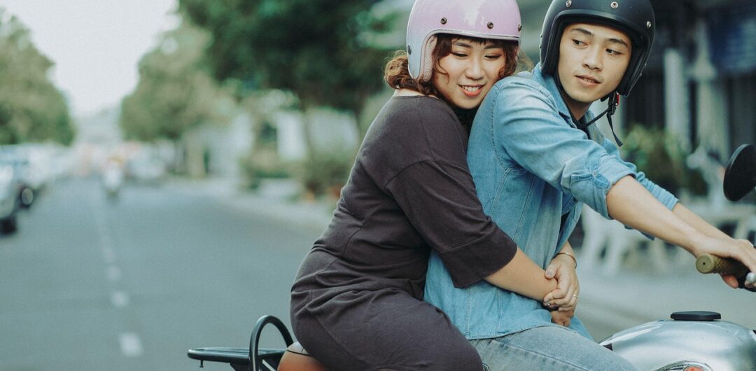 3 Awesome Ways to Travel Car, RV, or Motorcycle - Couple Riding Motorcycle