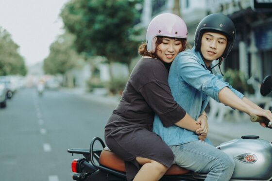 3 Awesome Ways to Travel Car, RV, or Motorcycle - Couple Riding Motorcycle