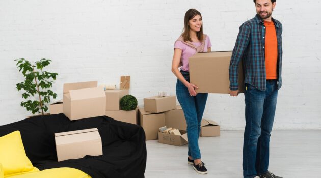 Homepage 3 Essential Packing Hacks for a Long-Distance Move - Couple Moving Boxes