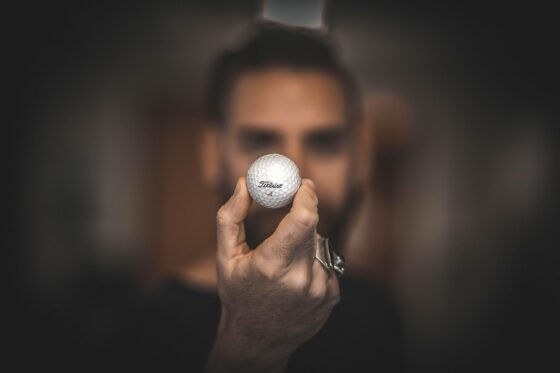 Transform Your Family Time With Indoor Golf Fun - Man Holding Golf Ball