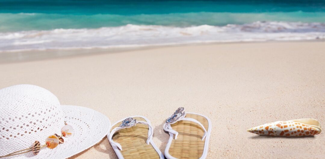 4 Easy Tips for Planning a Seamless Multi-Island Caribbean Escape 3 Tips for Planning a Seamless Multi-Island Caribbean Escape - Beach Hat and Sandals