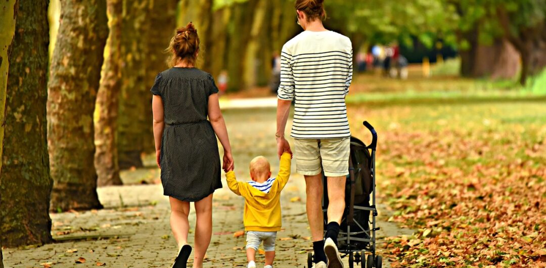 5 Ideas for Your 2026 Family Break 6 5 Ideas for Your 2026 Family Break - Family Holding Hands in Park
